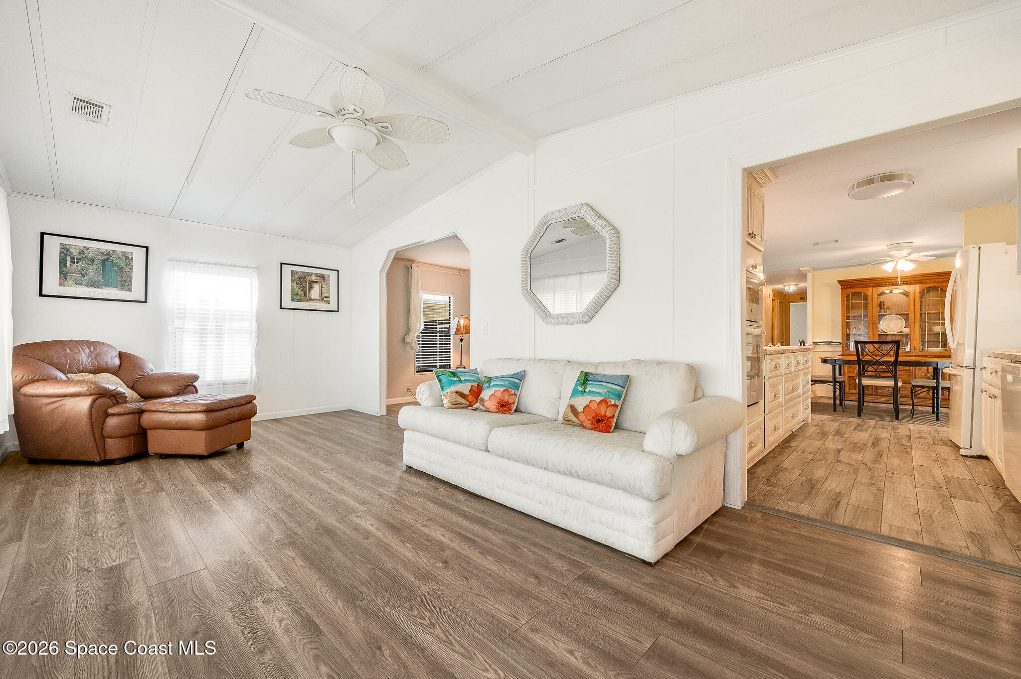 811 Silverthorn Court Barefoot Bay, FL 32976 - Photo 5 of 74 a living room with furniture and a wooden floor