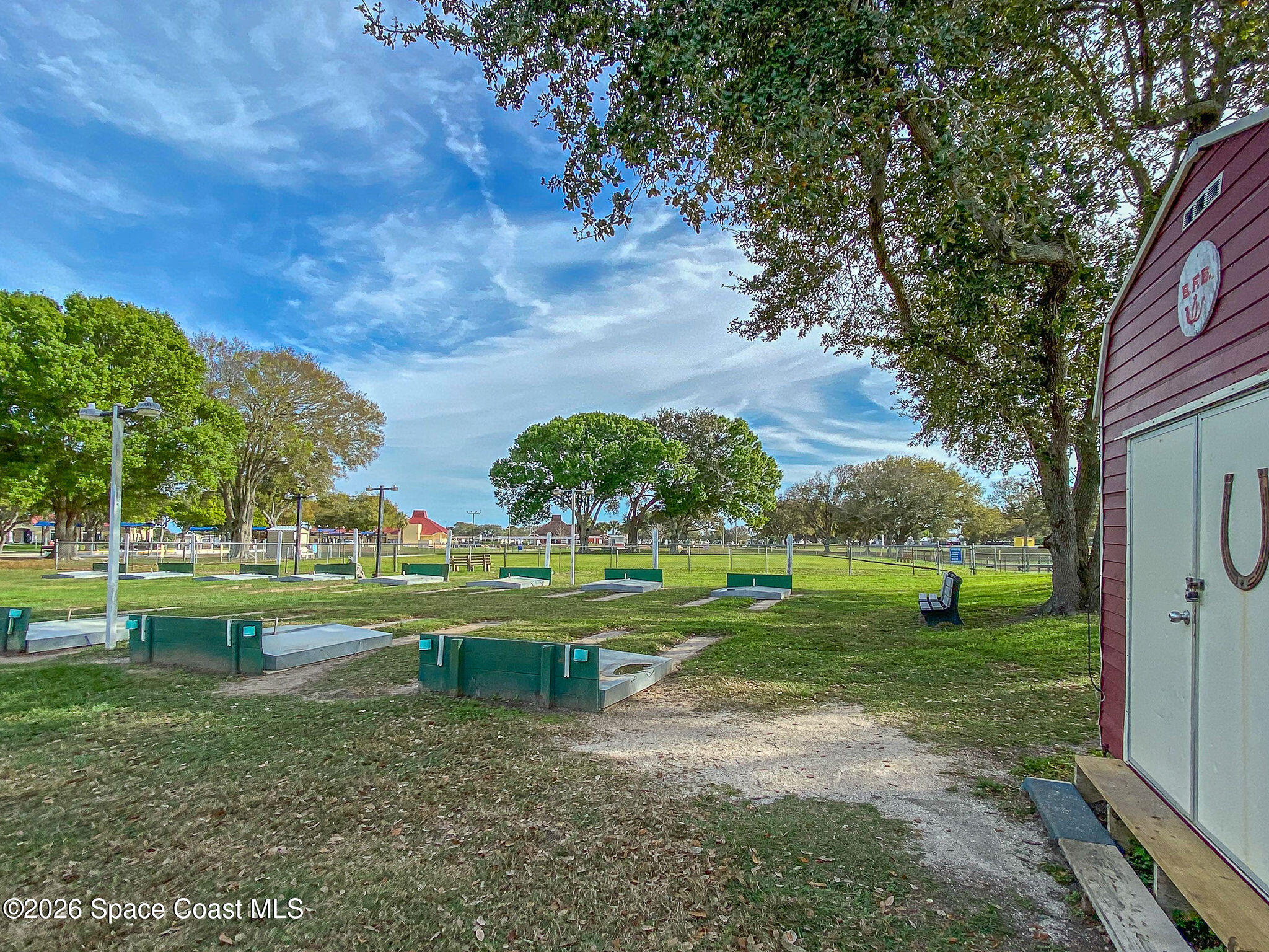 811 Silverthorn Court Barefoot Bay, FL 32976 - Photo 64 of 74 a view of a park with large trees