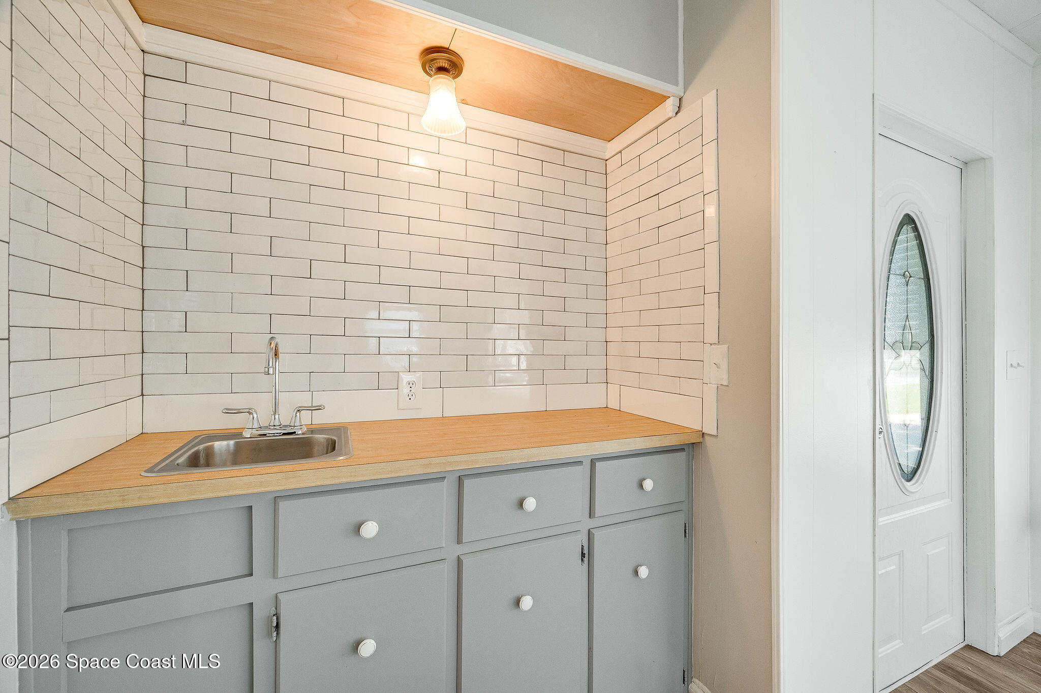811 Silverthorn Court Barefoot Bay, FL 32976 - Photo 7 of 74 a bathroom with a sink and a bathtub