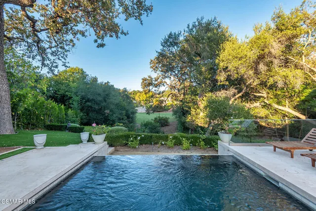 a view of a park with large trees