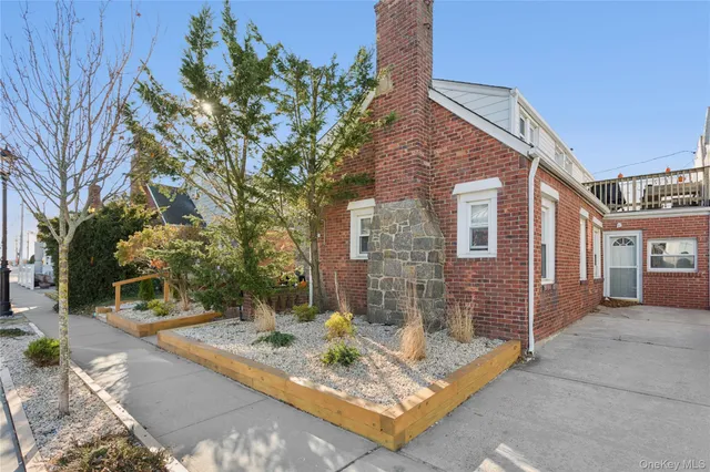 a view of a house with brick walls