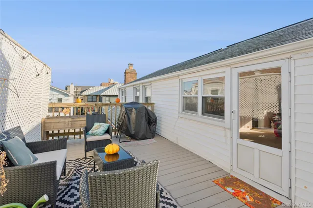 a living room with furniture a rug and a large window