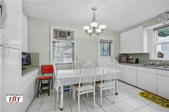 a living room with furniture and a book shelf