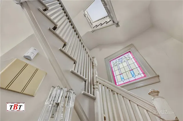 a bedroom with a bed couch and window