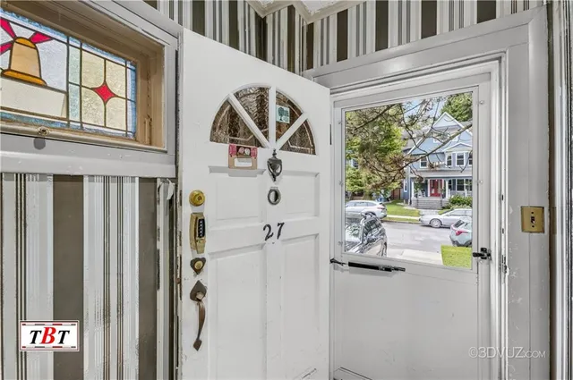 a view of living room with furniture and a window