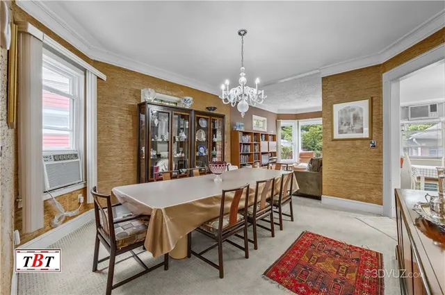 a view of a dining room with furniture and chandelier
