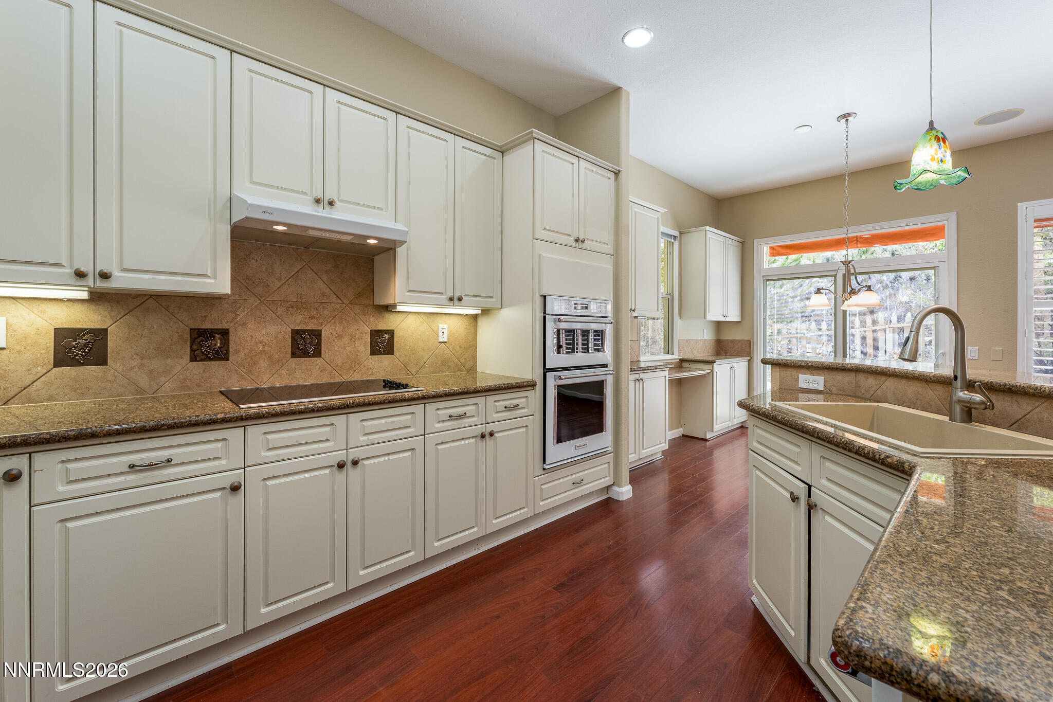 1840 Hunter Creek Road Reno, NV 89519 - Photo 5 of 39 a kitchen with granite countertop a sink stainless steel appliances and cabinets