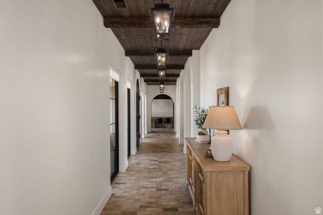 4871 South Homestead Way Washington, UT 84780 - Photo 61 of 151 Hallway featuring arched walkways and wood ceiling