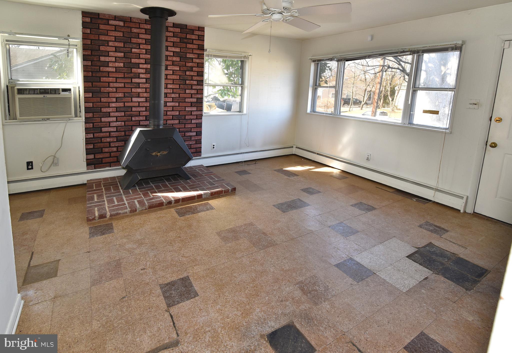 108 Roselawn Road Annapolis, MD 21403 - Photo 4 of 43 Sun filled living room with wood stove