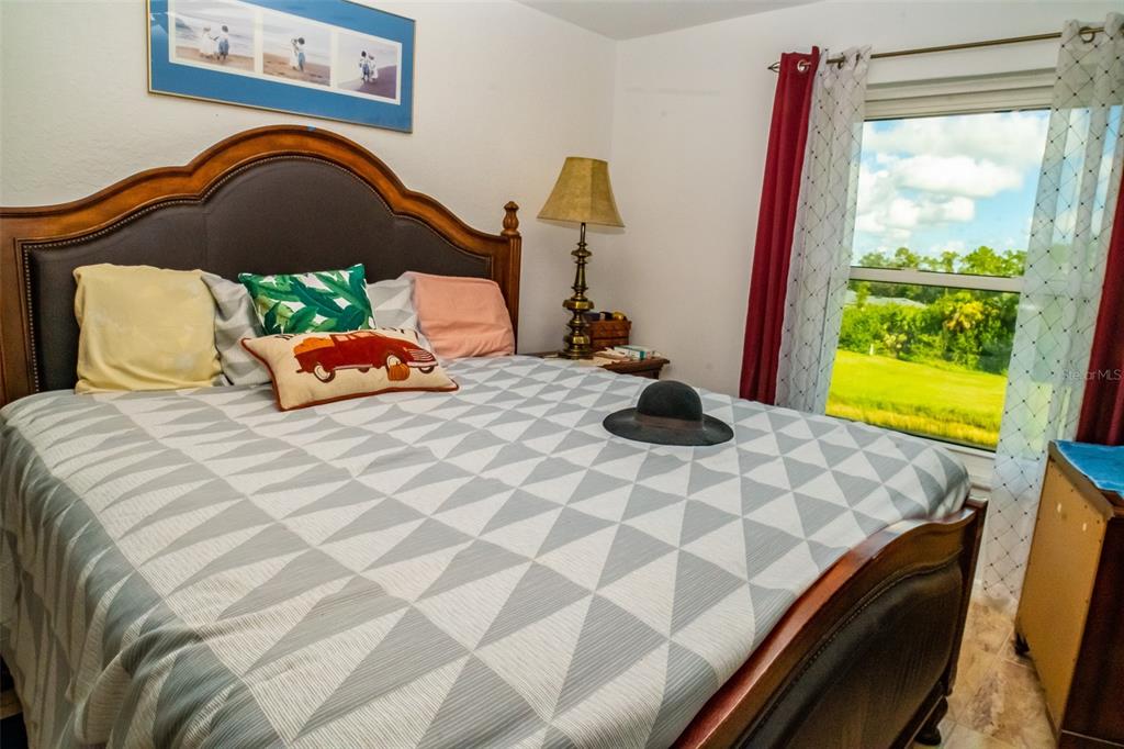 175 Kings Highway, Unit 933 Punta Gorda, FL 33983 - Photo 12 of 32 a bedroom with a bed and a window