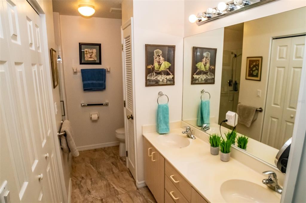 175 Kings Highway, Unit 933 Punta Gorda, FL 33983 - Photo 15 of 32 a bathroom with a sink mirror and vanity