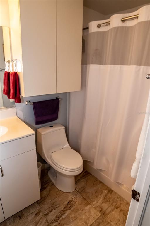 175 Kings Highway, Unit 933 Punta Gorda, FL 33983 - Photo 24 of 32 a bathroom with a toilet and a shower