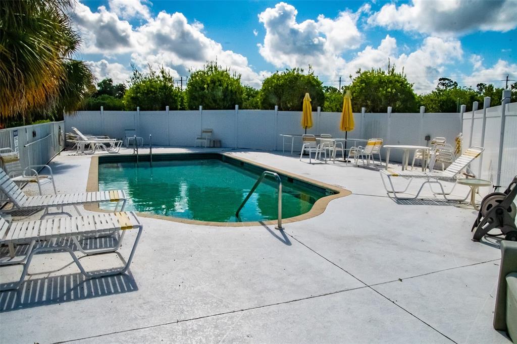 175 Kings Highway, Unit 933 Punta Gorda, FL 33983 - Photo 29 of 32 an outdoor sitting area with furniture and garden