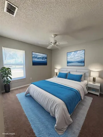 a bedroom with bed and window