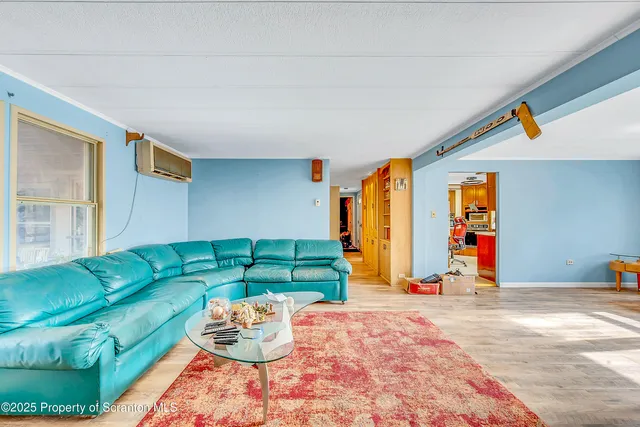 a bedroom with furniture and large windows