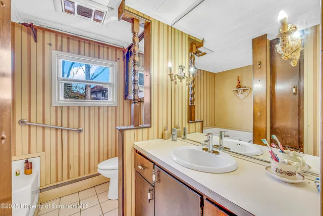 a bathroom with a tub and a window