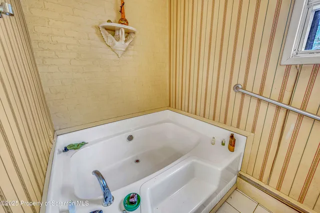 a bathroom with a sink a toilet and tub