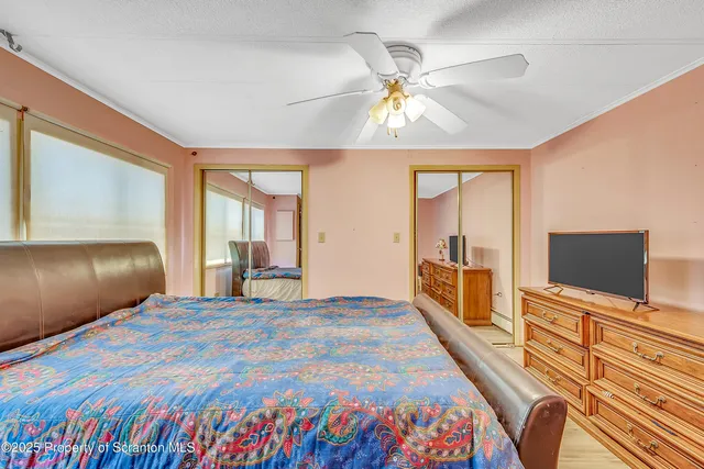 a bedroom with a bed and dresser