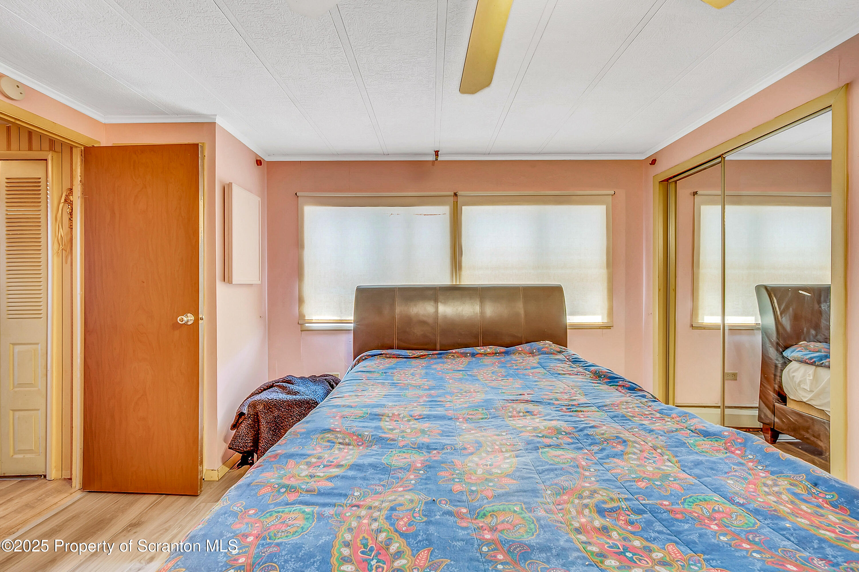 10 Bald Mt Road Clarks Summit, PA 18411 - Photo 27 of 42 a bedroom with a bed and a mirror