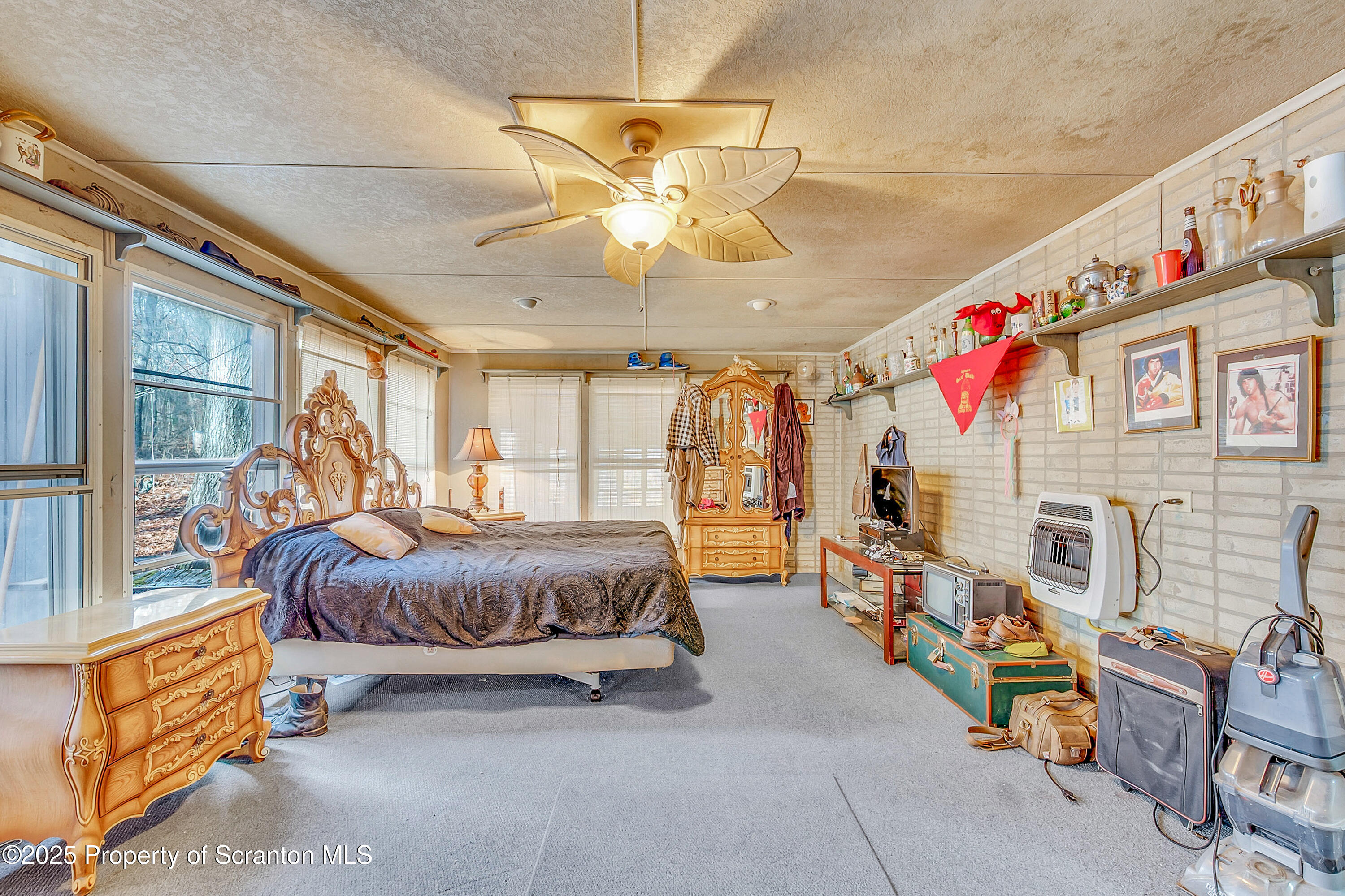 10 Bald Mt Road Clarks Summit, PA 18411 - Photo 28 of 42 a living room with furniture windows and a chandelier
