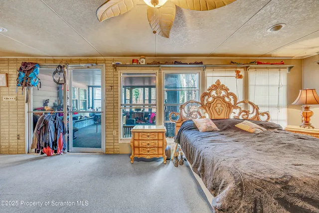 a room with musical instrument pool table and windows