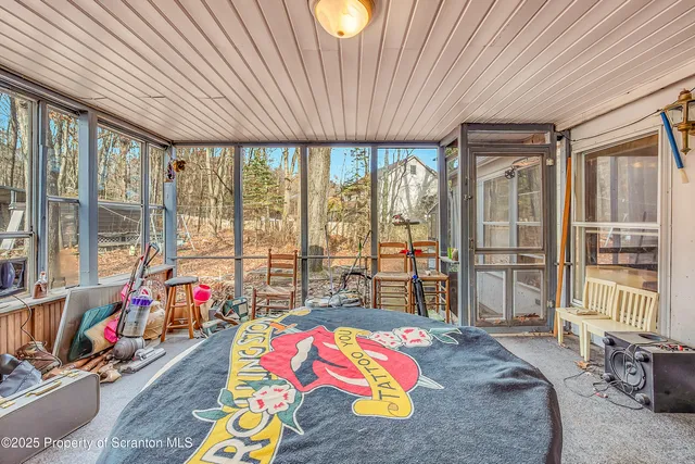 a bed room with a bed and a desk