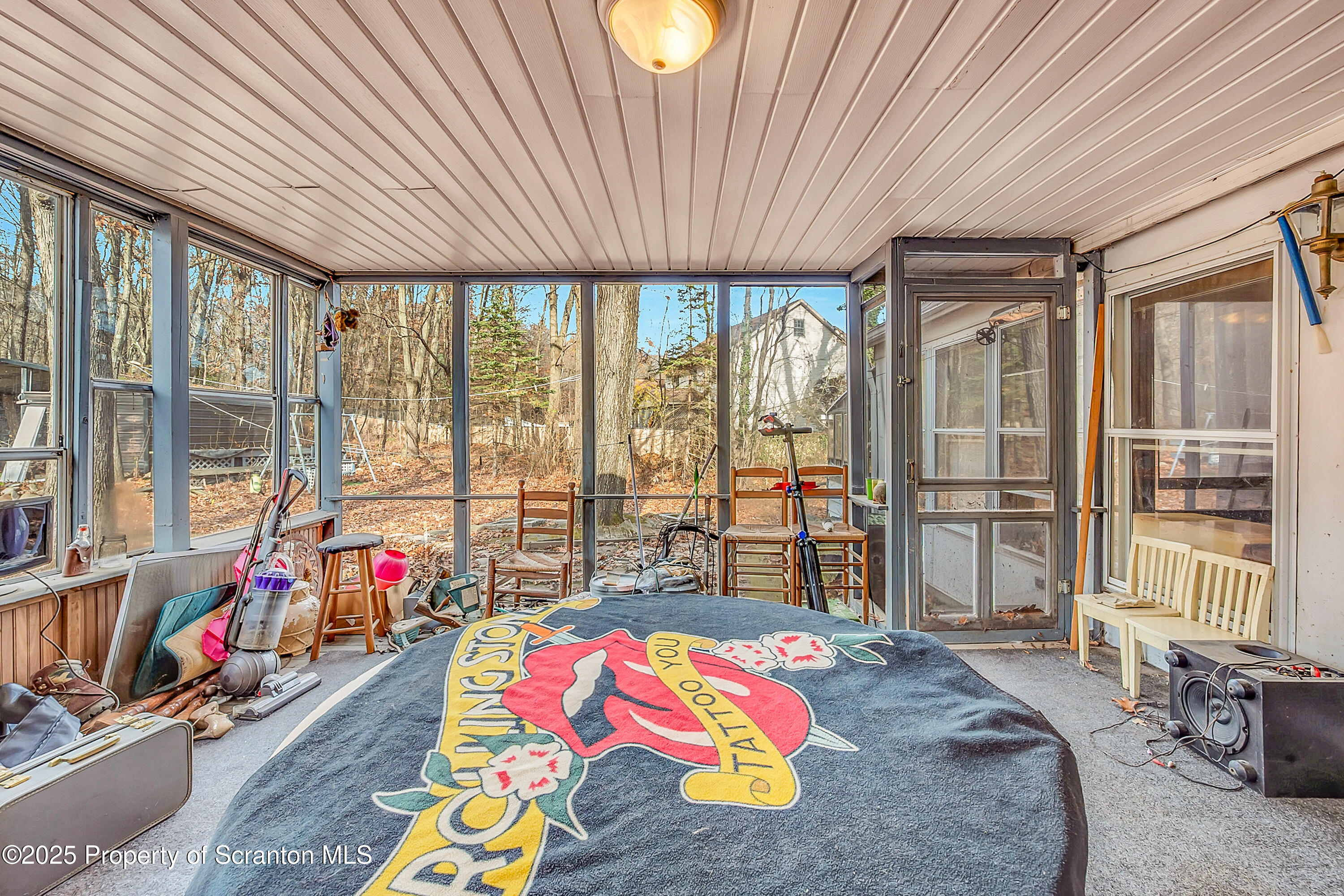 10 Bald Mt Road Clarks Summit, PA 18411 - Photo 32 of 42 a bedroom with furniture and large windows