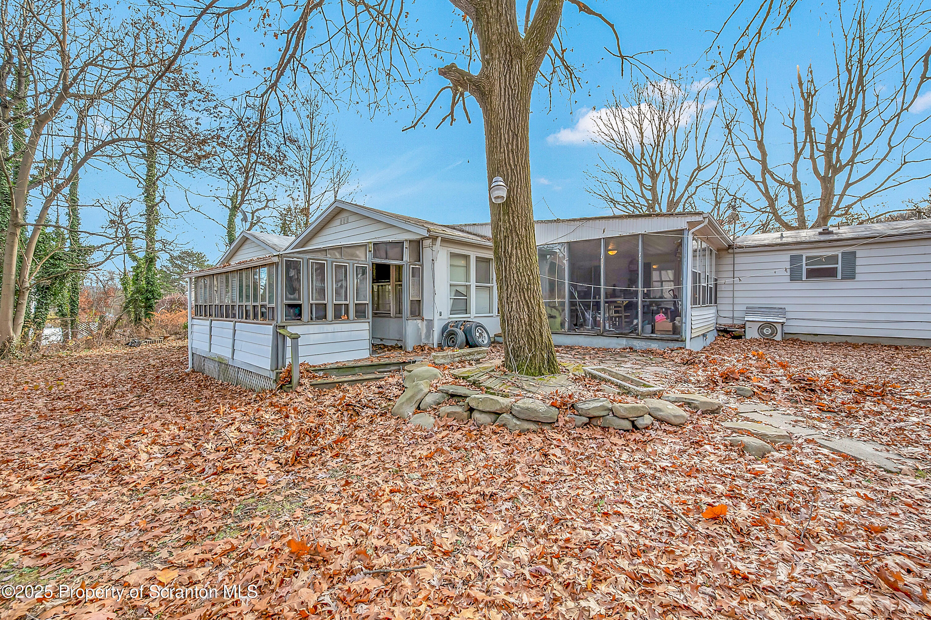 10 Bald Mt Road Clarks Summit, PA 18411 - Photo 4 of 42 a house that has a tree in front of it