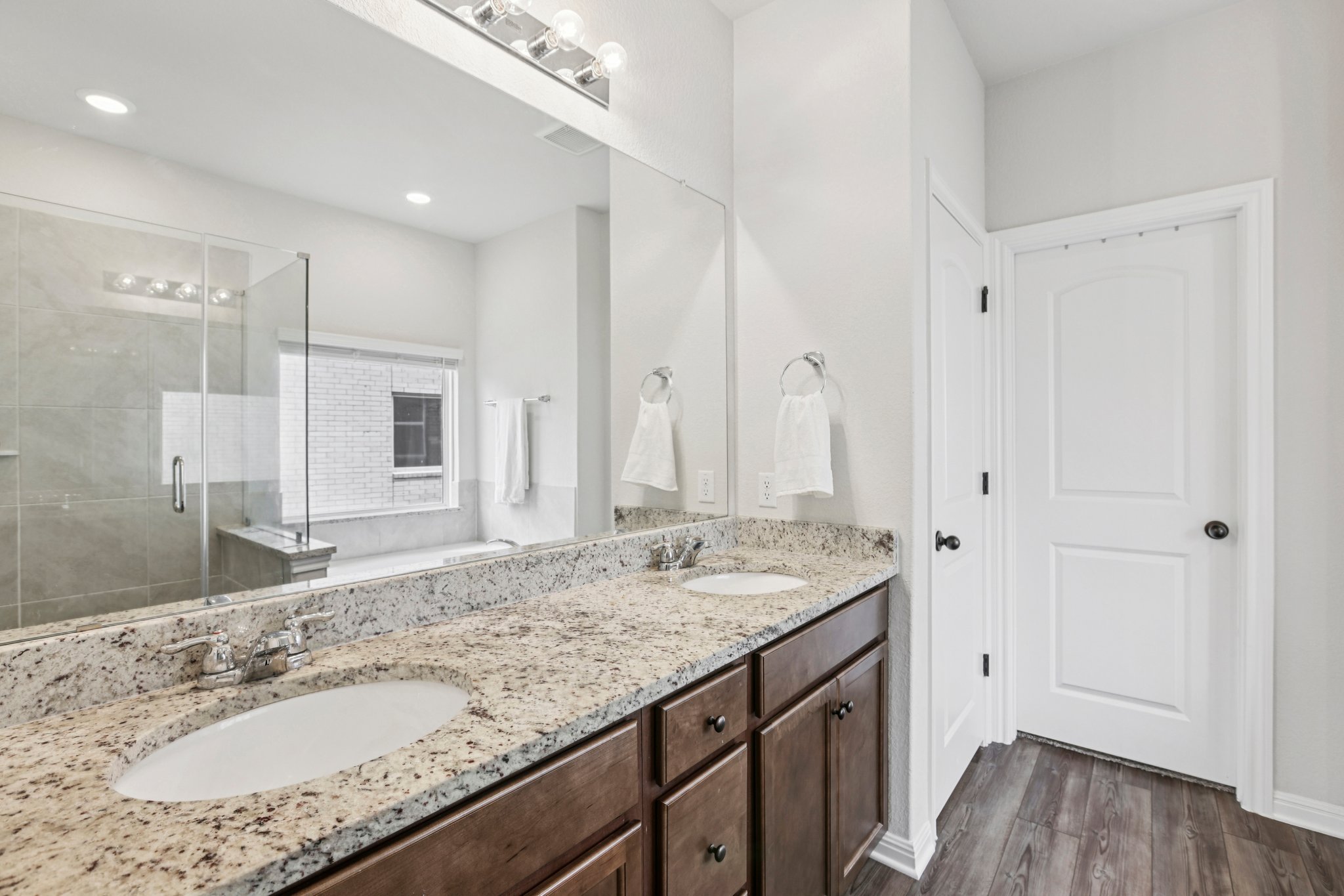 204 Swinging H Lane Georgetown, TX 78633 - Photo 14 of 39 a bathroom with a granite countertop sink and a mirror