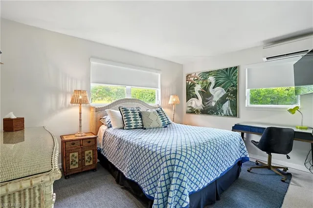 a bedroom with a bed and a table in it