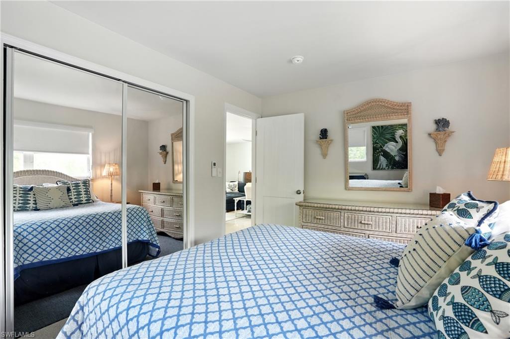 578 14th Street North Naples, FL 34102 - Photo 18 of 28 a bedroom with a bed and window