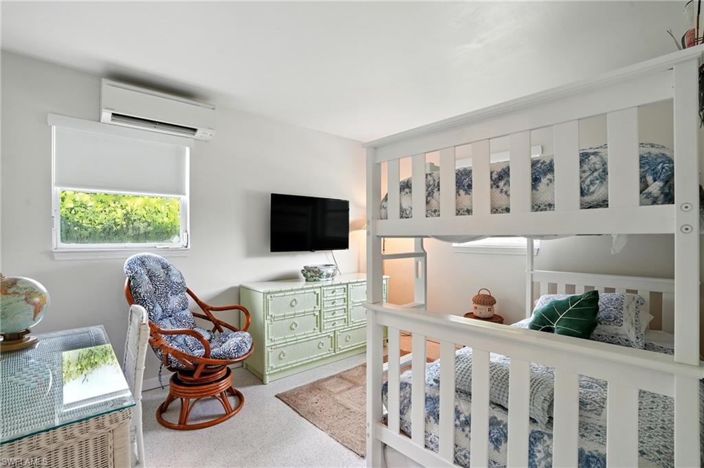 578 14th Street North Naples, FL 34102 - Photo 20 of 28 a view of a livingroom with wooden floor and windows