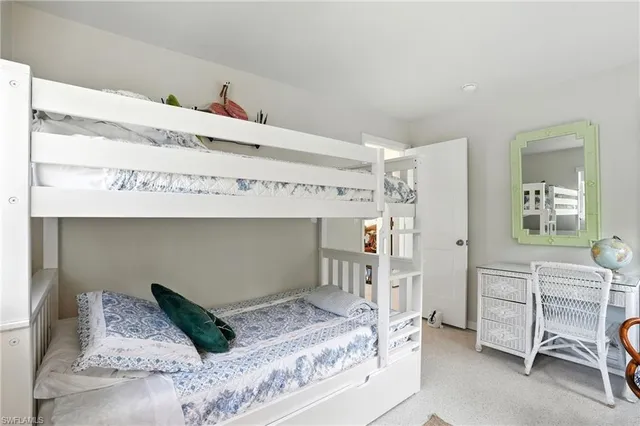 a bedroom with a bed and a cabinets