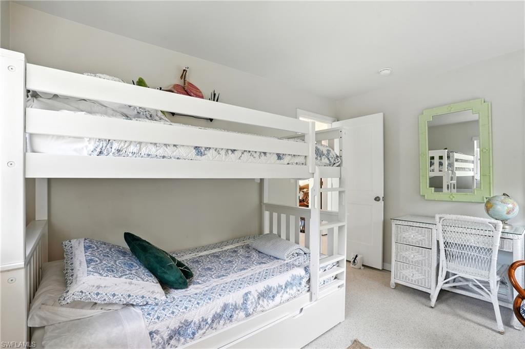 578 14th Street North Naples, FL 34102 - Photo 21 of 28 a bedroom with a bed and a cabinets