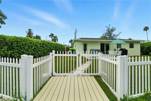 a view of a house with wooden deck