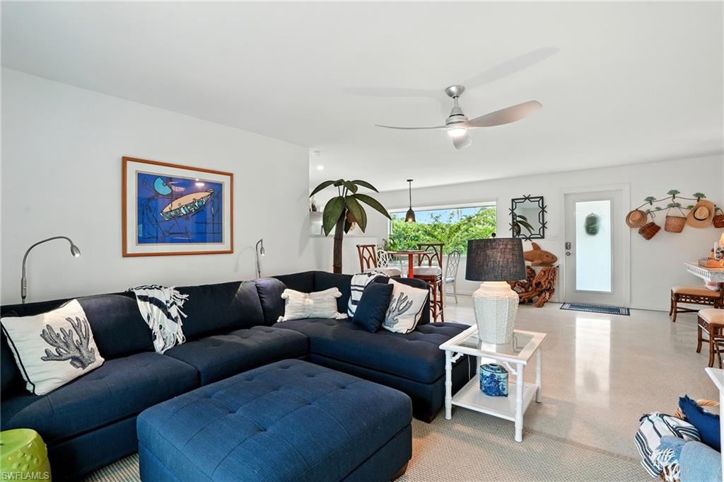 578 14th Street North Naples, FL 34102 - Photo 4 of 28 a living room with furniture and a ceiling fan