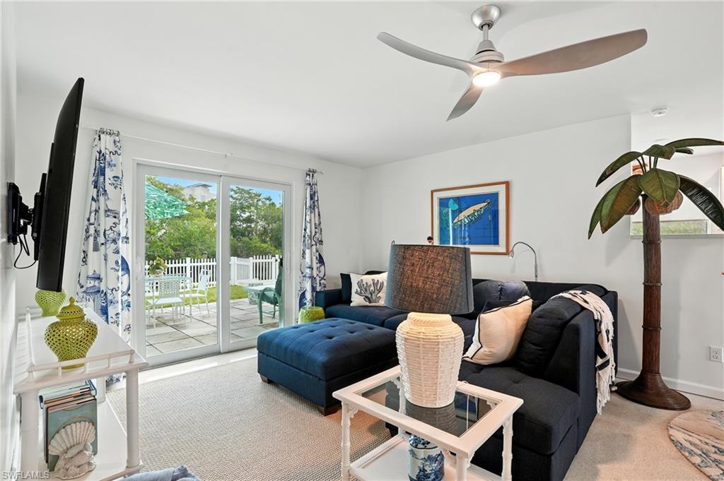 578 14th Street North Naples, FL 34102 - Photo 5 of 28 a living room with furniture and a flat screen tv