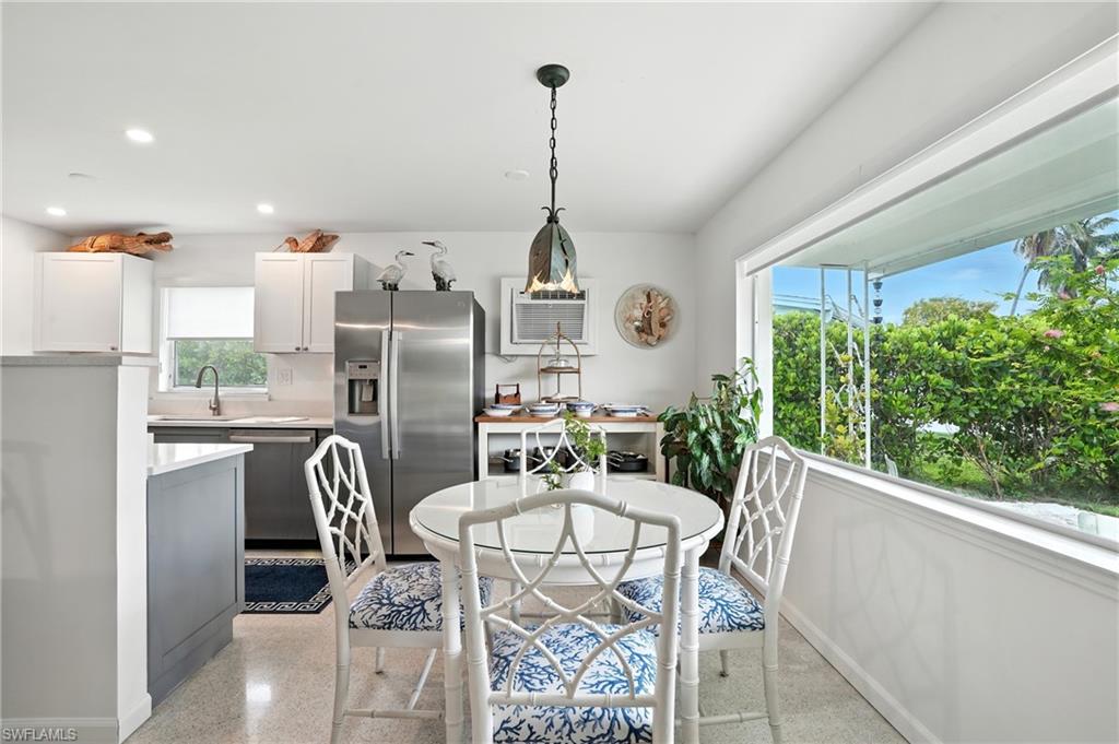 578 14th Street North Naples, FL 34102 - Photo 8 of 28 a view of a dining room with furniture window and outside view