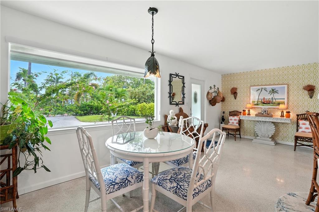 578 14th Street North Naples, FL 34102 - Photo 10 of 28 a view of a dining room with furniture window and outside view