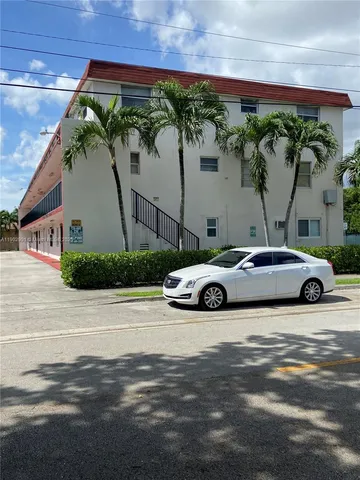 a view of a cars parked in front of a building