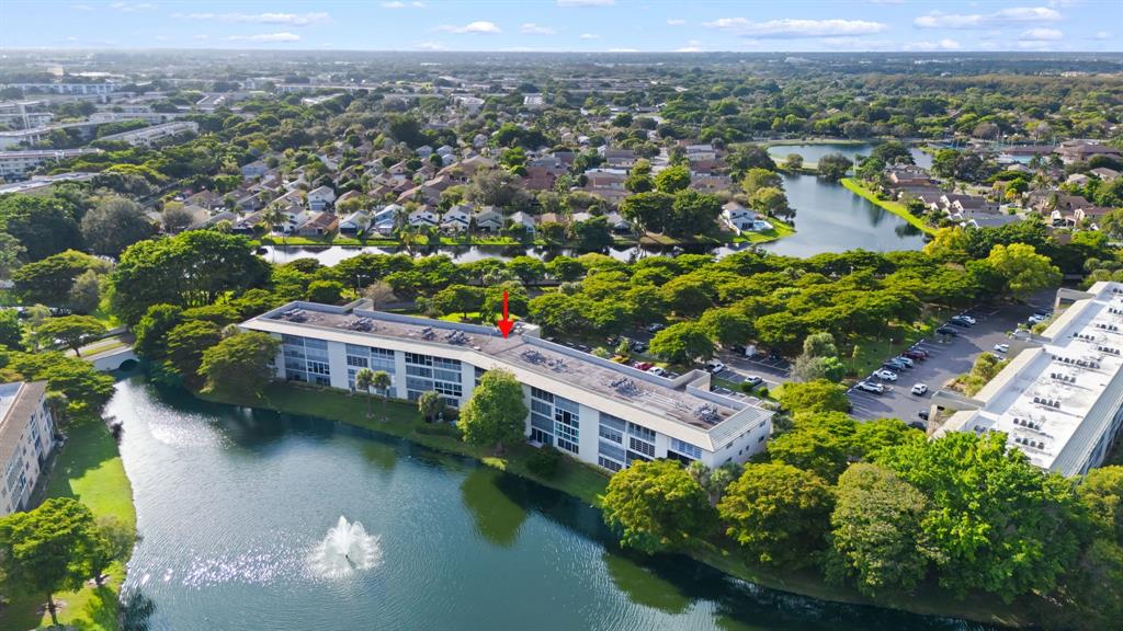 an aerial view of residential houses with outdoor space and river view