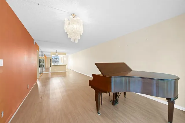 a view of a livingroom with furniture and wooden floor