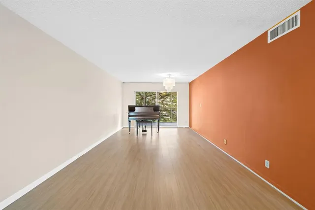 a workspace with furniture and wooden floor