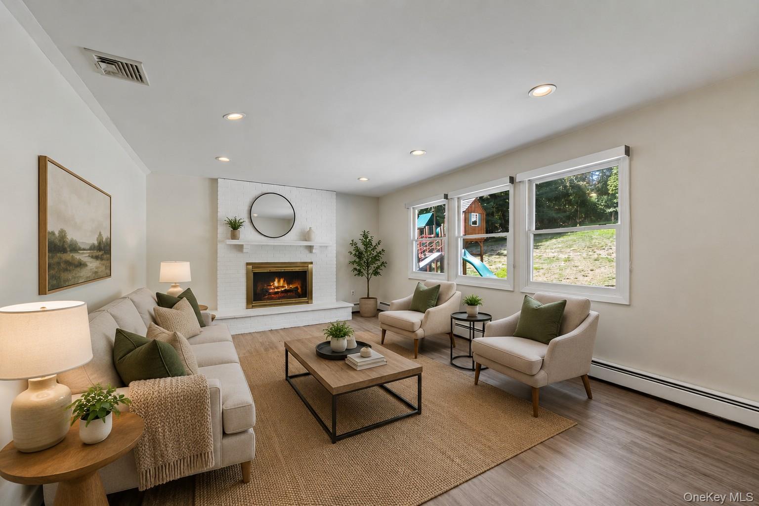 10 Demarest Road Spring Valley, NY 10977 - Photo 11 of 39 a living room with furniture and a fireplace