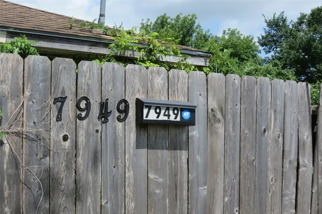 a view of outdoor space with wooden wall