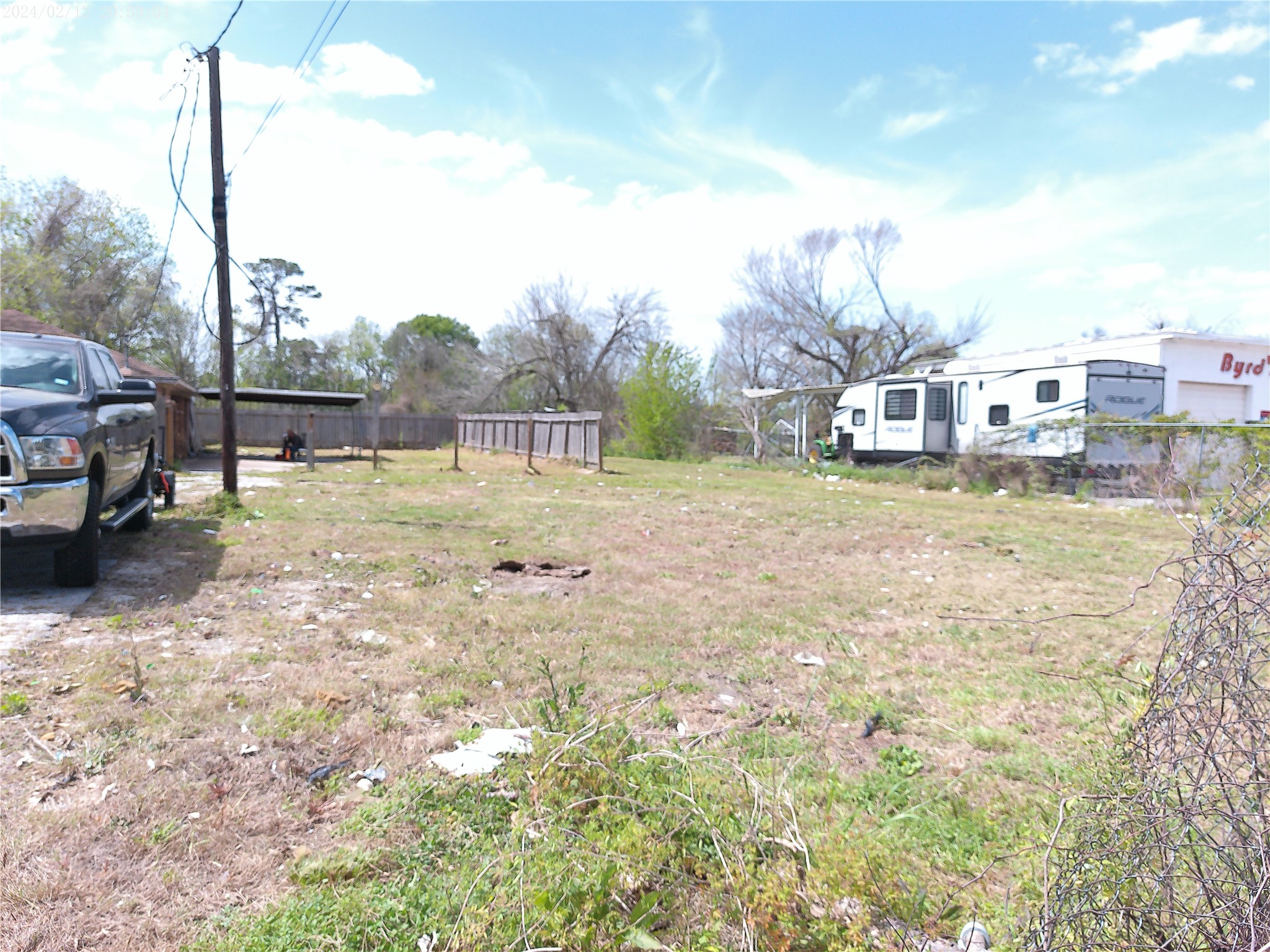 7949 Lockwood Drive Houston, TX 77016 - Photo 15 of 28 a view of a yard with a car park in front of it