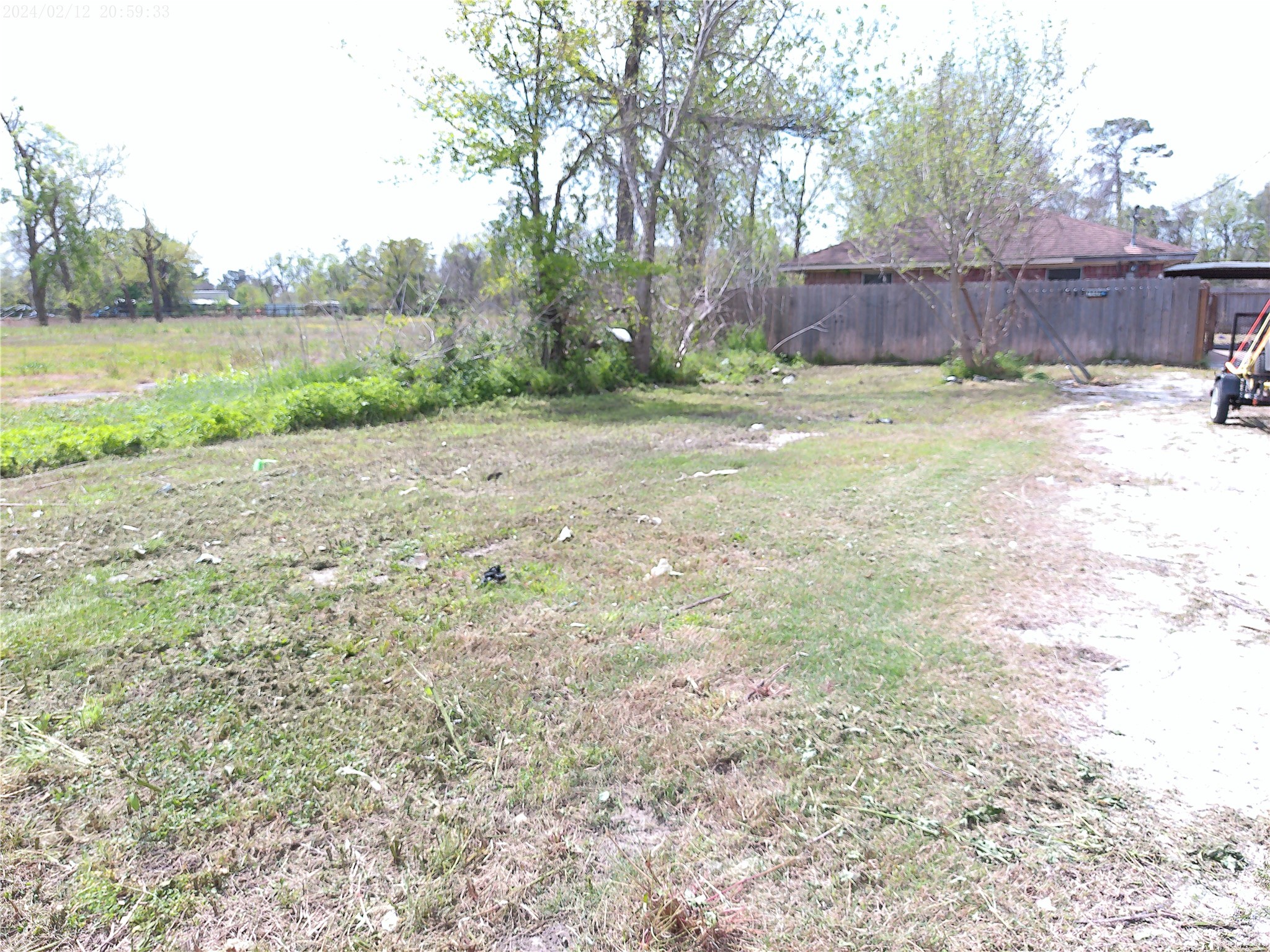 7949 Lockwood Drive Houston, TX 77016 - Photo 16 of 28 a view of a backyard with large trees