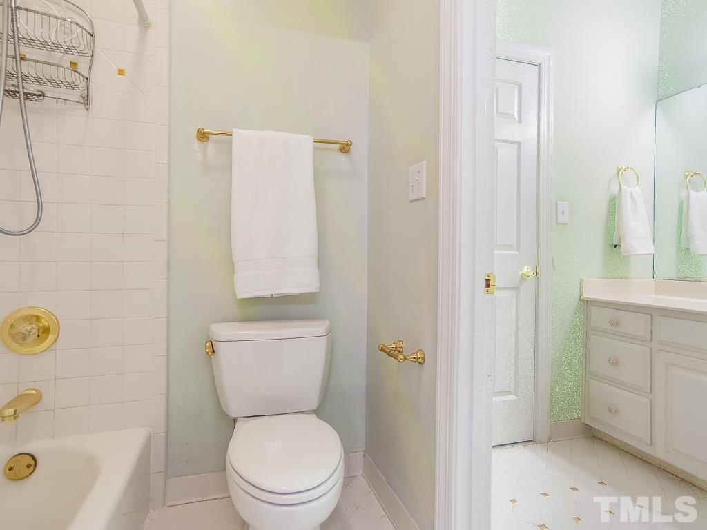 1905 Chase Court Raleigh, NC 27607 - Photo 35 of 61 a bathroom with a sink a toilet and shower