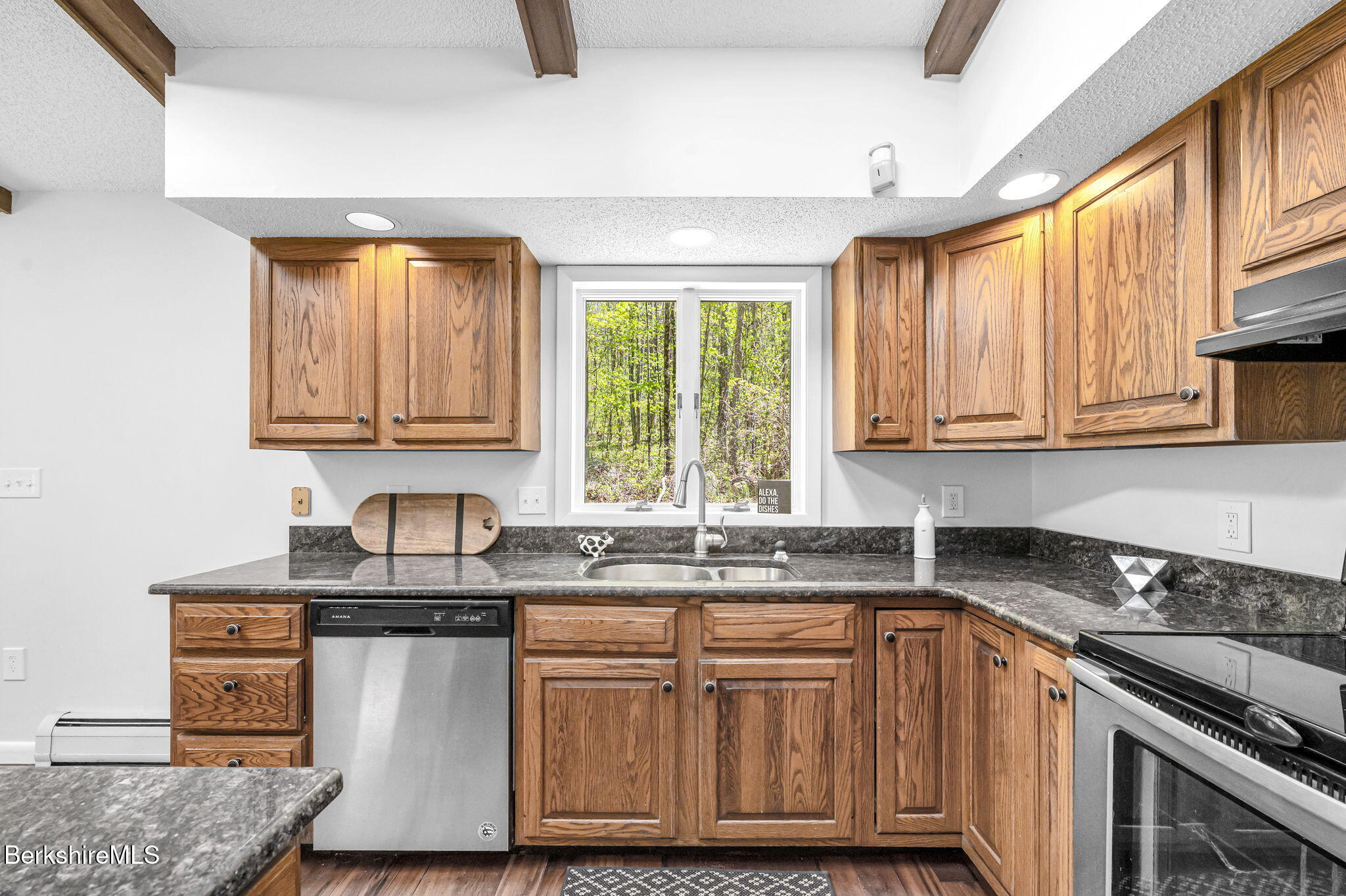 1874 Home Road Sheffield, MA 01230 - Photo 19 of 42 a kitchen with stainless steel appliances granite countertop a sink stove and cabinets