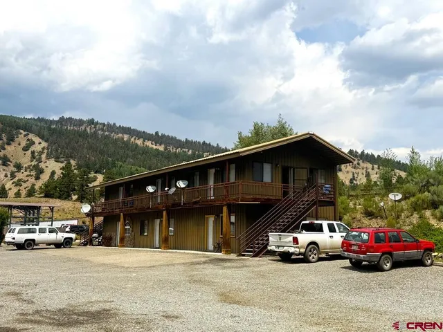 a view of street with parked cars